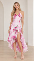 Front view of model wearing Blush Pink floral print ruffle high-low maxi dress