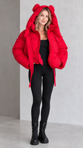 Full front view of model wearing red cropped puffer jacket with bear ear hood