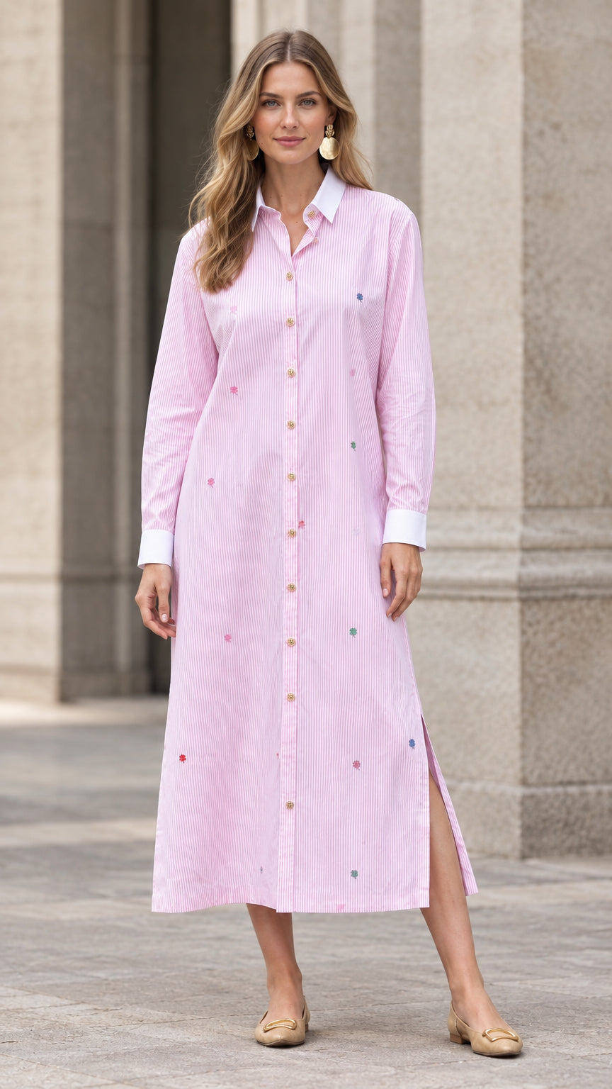 Front full view of woman wearing pink striped embroidered maxi shirt dress with white collar