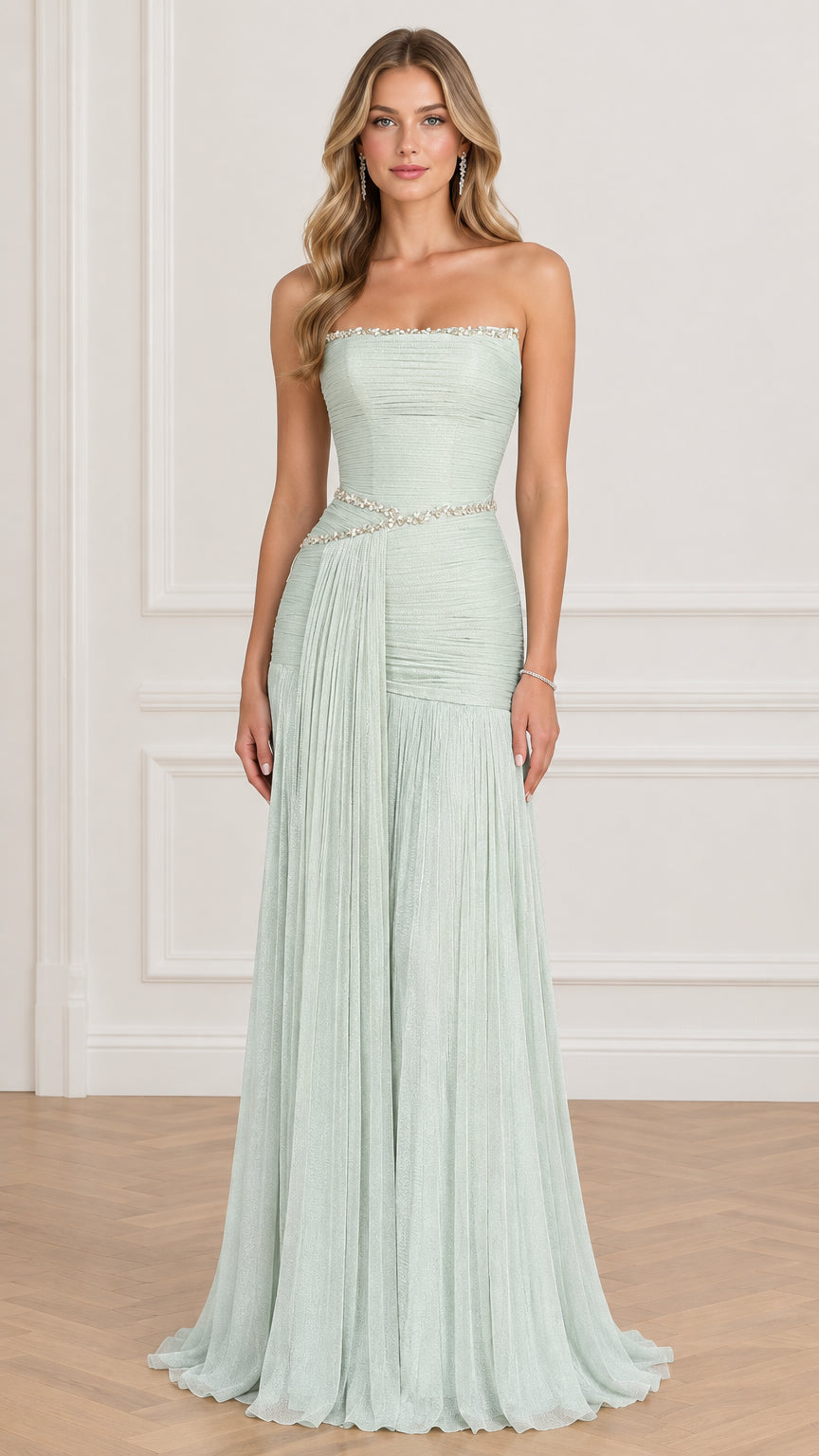 Front view of model wearing sage green strapless pleated evening gown