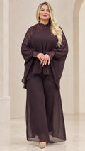 Front view of woman wearing Plum chiffon cape top and wide-leg pant set with sequin mock neck