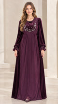 Front full-length view of woman wearing Plum embroidered velvet pleated maxi dress