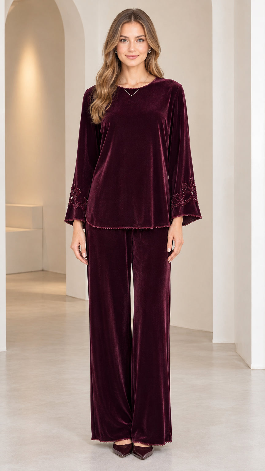 Full front view of model wearing Burgundy velvet two-piece top and wide-leg pant set