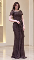 Front view of model wearing Chocolate Brown lace evening gown with beaded neckline and draped waist