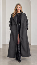 Front view of model wearing full-length Charcoal Grey maxi belted overcoat