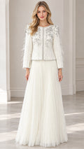 Front full view of woman wearing ivory beaded jacket and pleated maxi skirt two-piece formal set