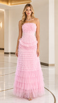 Front full view of woman wearing strapless pink tiered ruffle tulle evening maxi gown