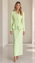 Front view of model wearing mint green peplum blazer and matching maxi skirt set