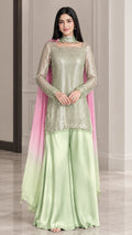 Front full view of woman wearing mint green sequin kurti and sharara set with pink ombre dupatta