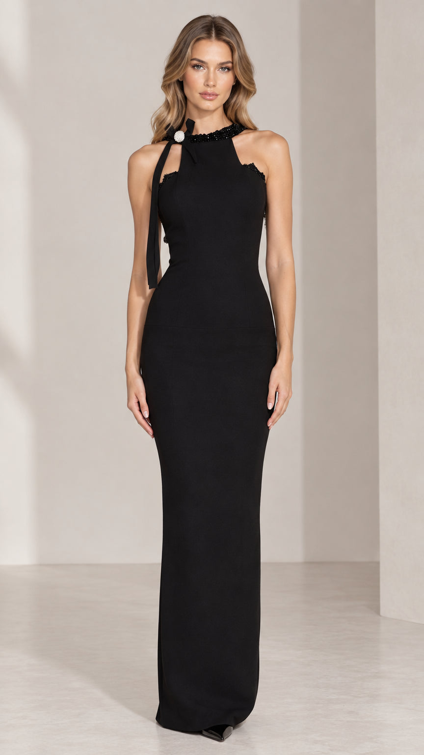 Front view of black halter maxi dress with beaded neckline and shoulder bow brooch