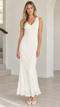 Front view of model wearing ivory sleeveless lace maxi dress with V-neckline