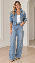 Model wearing light blue floral embellished denim jacket and wide-leg jeans two-piece set, full front view