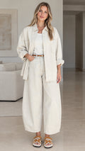 Women's relaxed button-down shirt and wide-leg pants set in cream front view