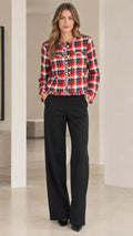 Front view of model wearing red and black plaid cropped tweed jacket with wide leg black pants