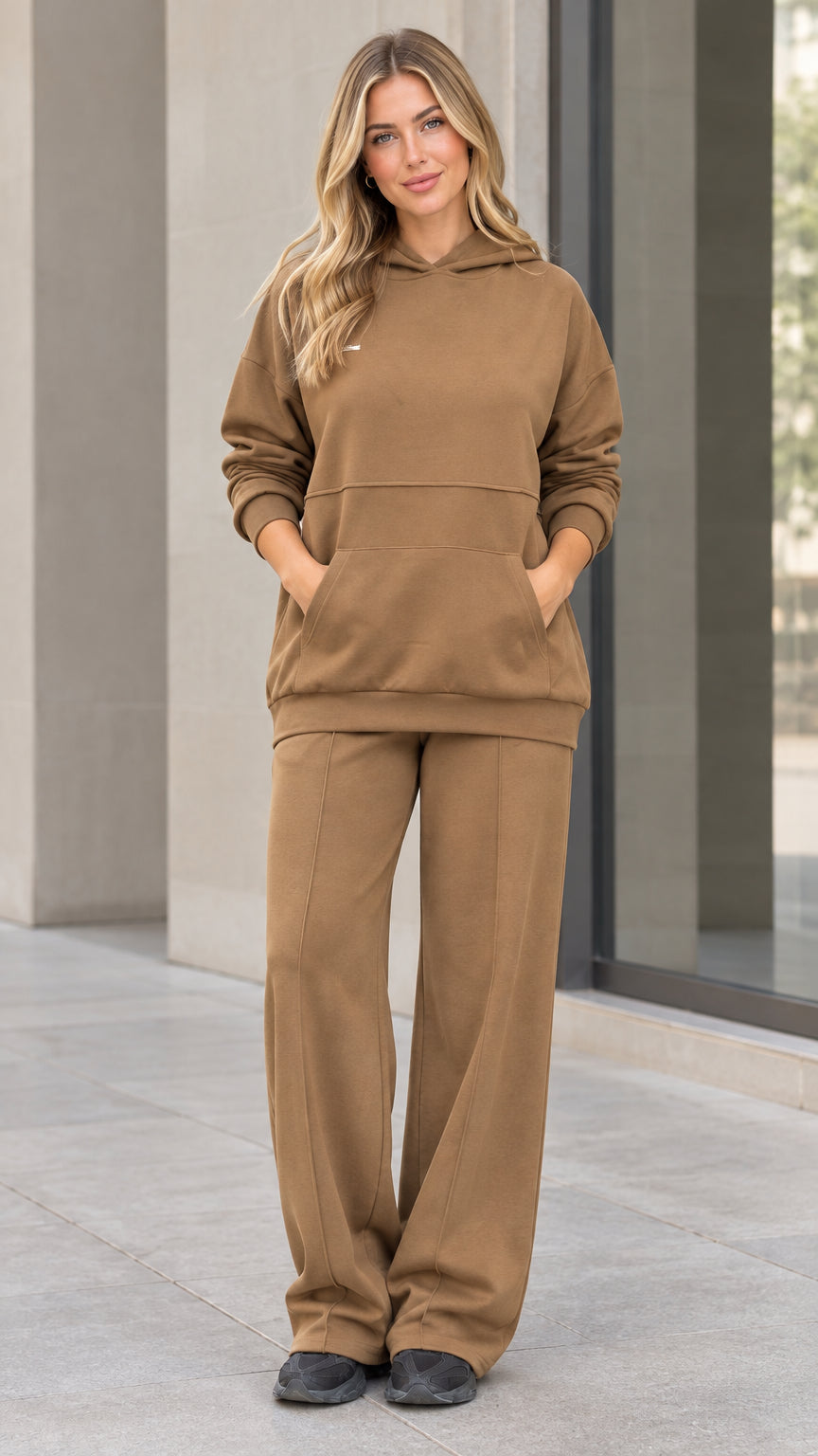 Front view of woman wearing camel fleece hoodie and wide-leg sweatpants matching lounge set