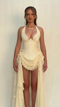 Front view of model wearing Champagne halter corset high-slit gown with floral lace train