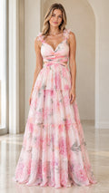 Front view of woman wearing pink floral cutout tiered maxi dress with 3D floral shoulder straps