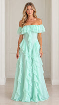 Front full-length view of woman wearing mint green off-the-shoulder tiered ruffle maxi gown