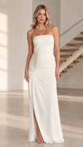 Model wearing white strapless ruched maxi dress with lace side panel and slit - front view