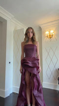 Model wearing Burgundy strapless tiered ruffle evening gown front view