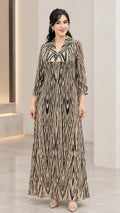 Women's long sleeve sequin-accented printed maxi dress in champagne gold front view