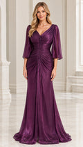 Front full view of woman wearing Plum Purple ruched V-neck evening gown with flutter sleeves