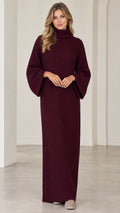Full front view of model wearing burgundy turtleneck ribbed knit maxi sweater dress with flared sleeves