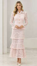 Full front view of model wearing Blush Pink lace peplum jacket and tiered maxi skirt set
