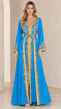 Front full view of woman wearing sky blue embroidered Moroccan kaftan maxi dress with gold trim