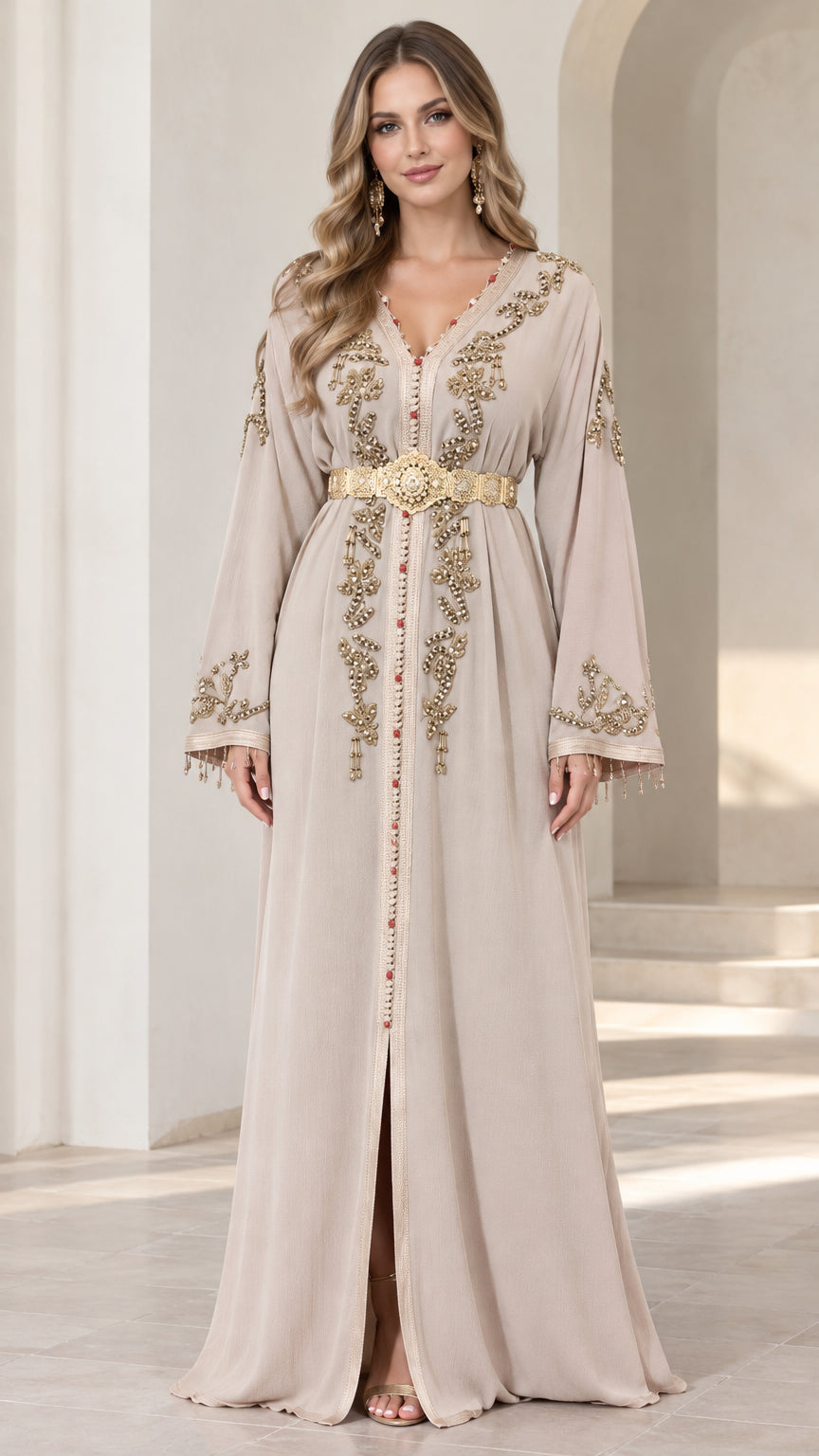Front view of model wearing beige embroidered caftan maxi dress with gold belt