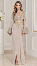 Front view of model wearing beige embroidered kaftan maxi dress with gold belt