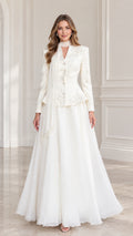 Front full-length view of Ivory embroidered peplum evening gown set with draped scarf
