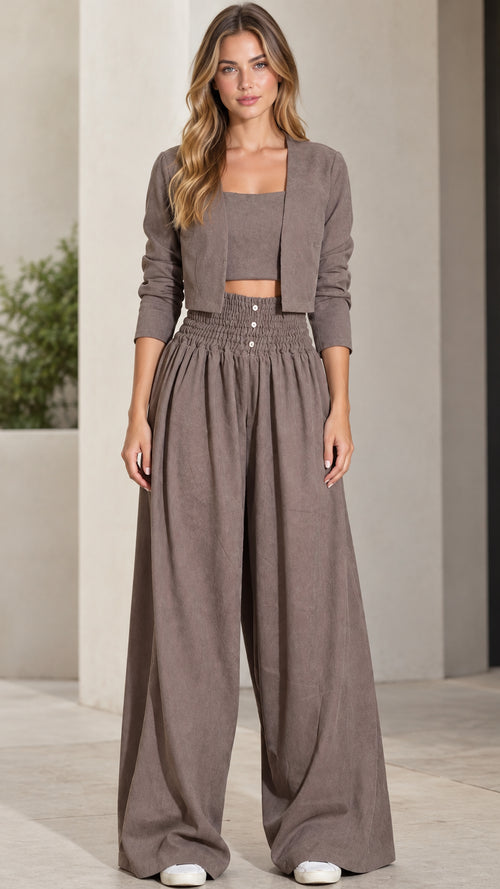 Front full view of woman wearing taupe 3-piece cropped jacket, crop top, and wide-leg pants set
