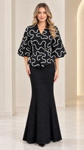 Full front view of model wearing black textured peplum top and mermaid maxi skirt set