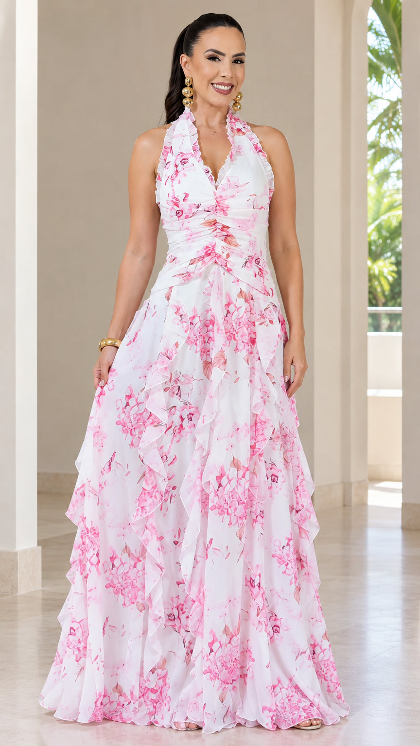Front view of woman wearing white floral halter neck tiered maxi dress