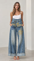 Front full view of Washed Blue Fold-Over Waist Graphic Wide-Leg Jeans