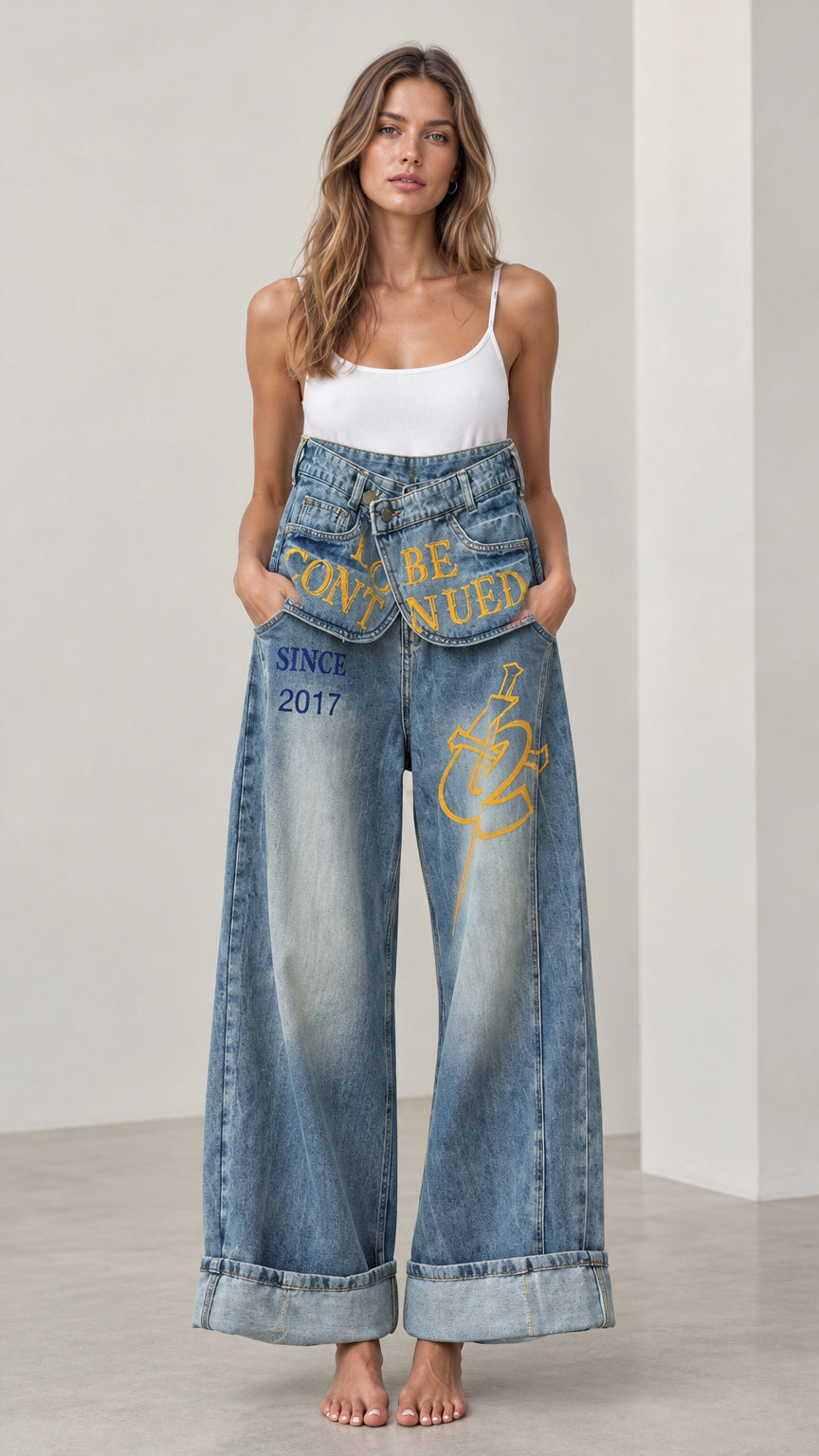 Front full view of Washed Blue Fold-Over Waist Graphic Wide-Leg Jeans