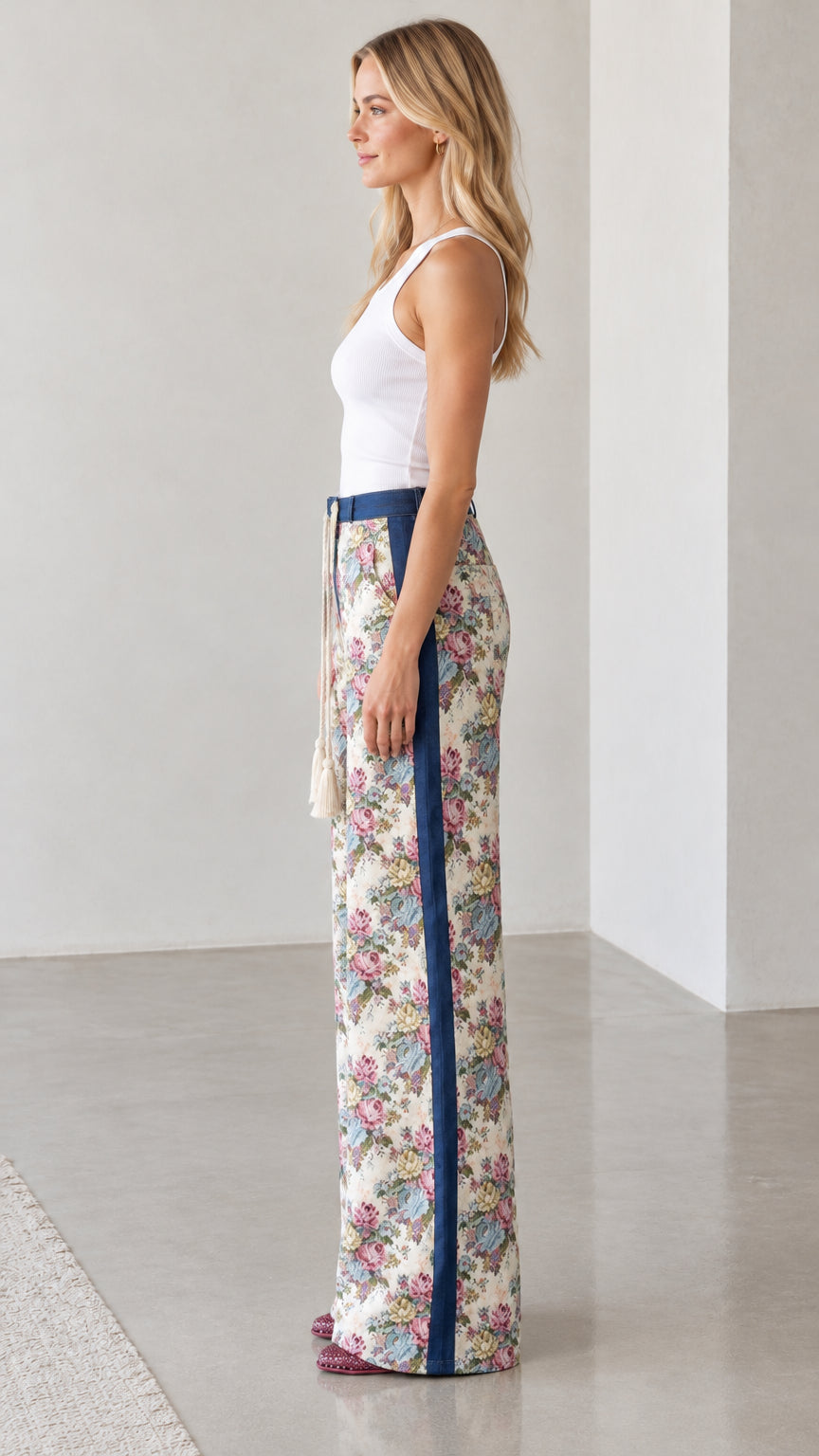 Side profile view showing side stripe detail on Cream Floral wide-leg trousers