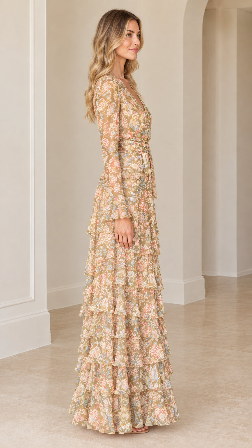 Side profile of model in beige floral tiered ruffle maxi dress