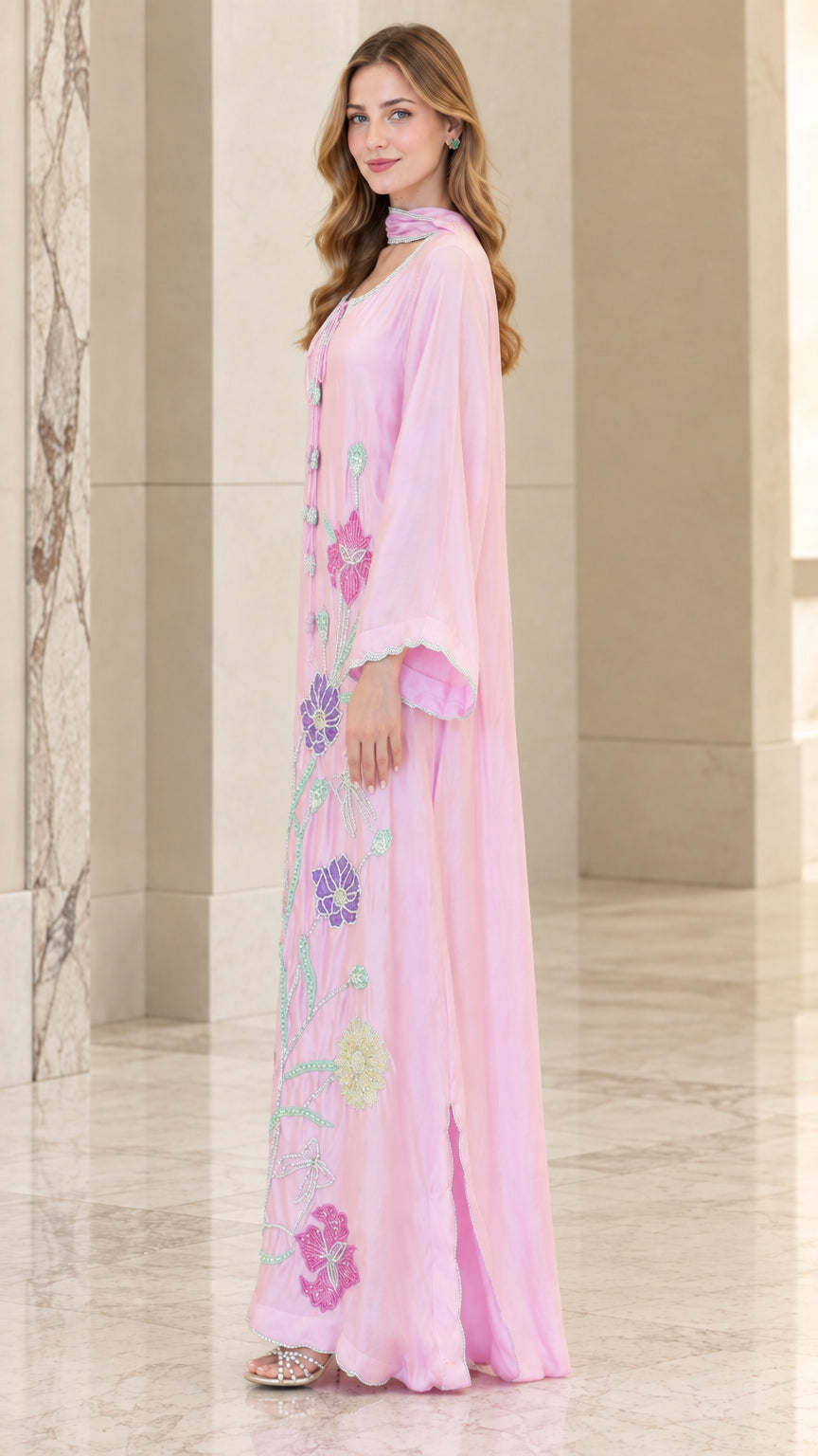 Side full view of woman wearing Light Pink embroidered kaftan maxi dress