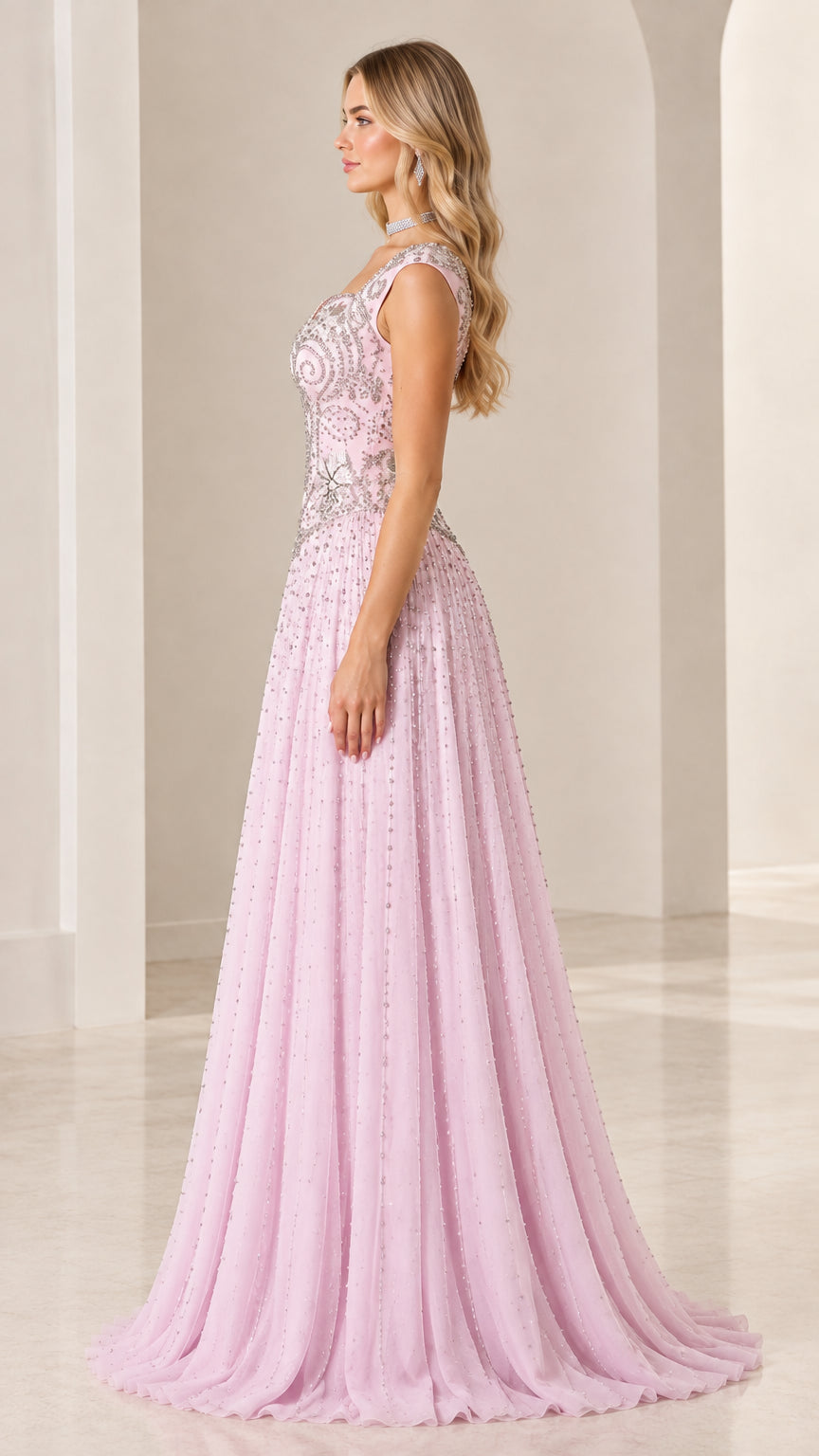 Side profile view of blush pink floor-length beaded formal gala dress