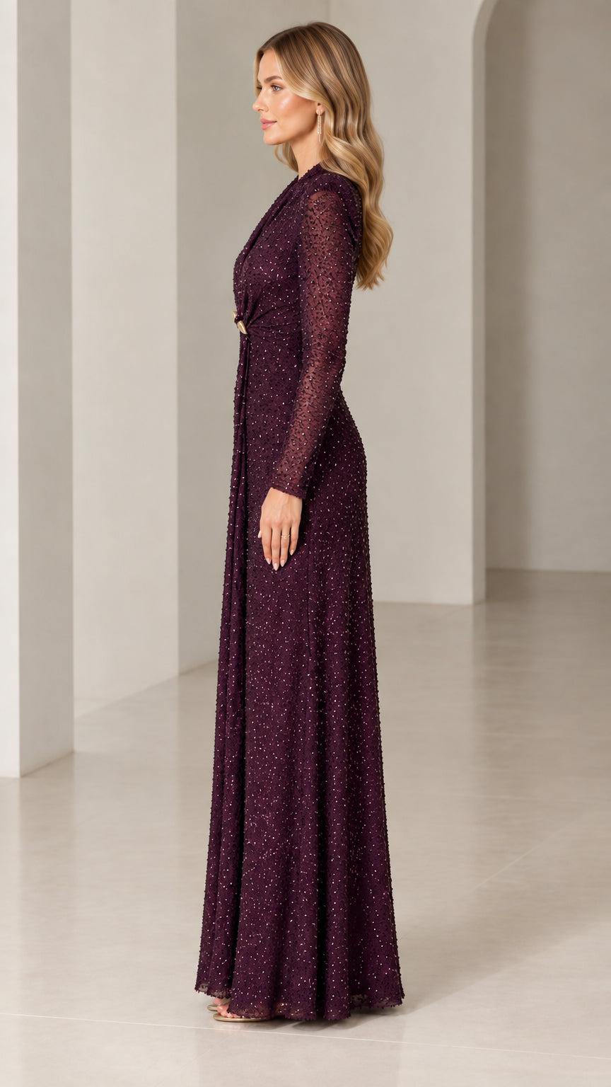 Side profile of burgundy sequin floor-length formal gown with long sleeves