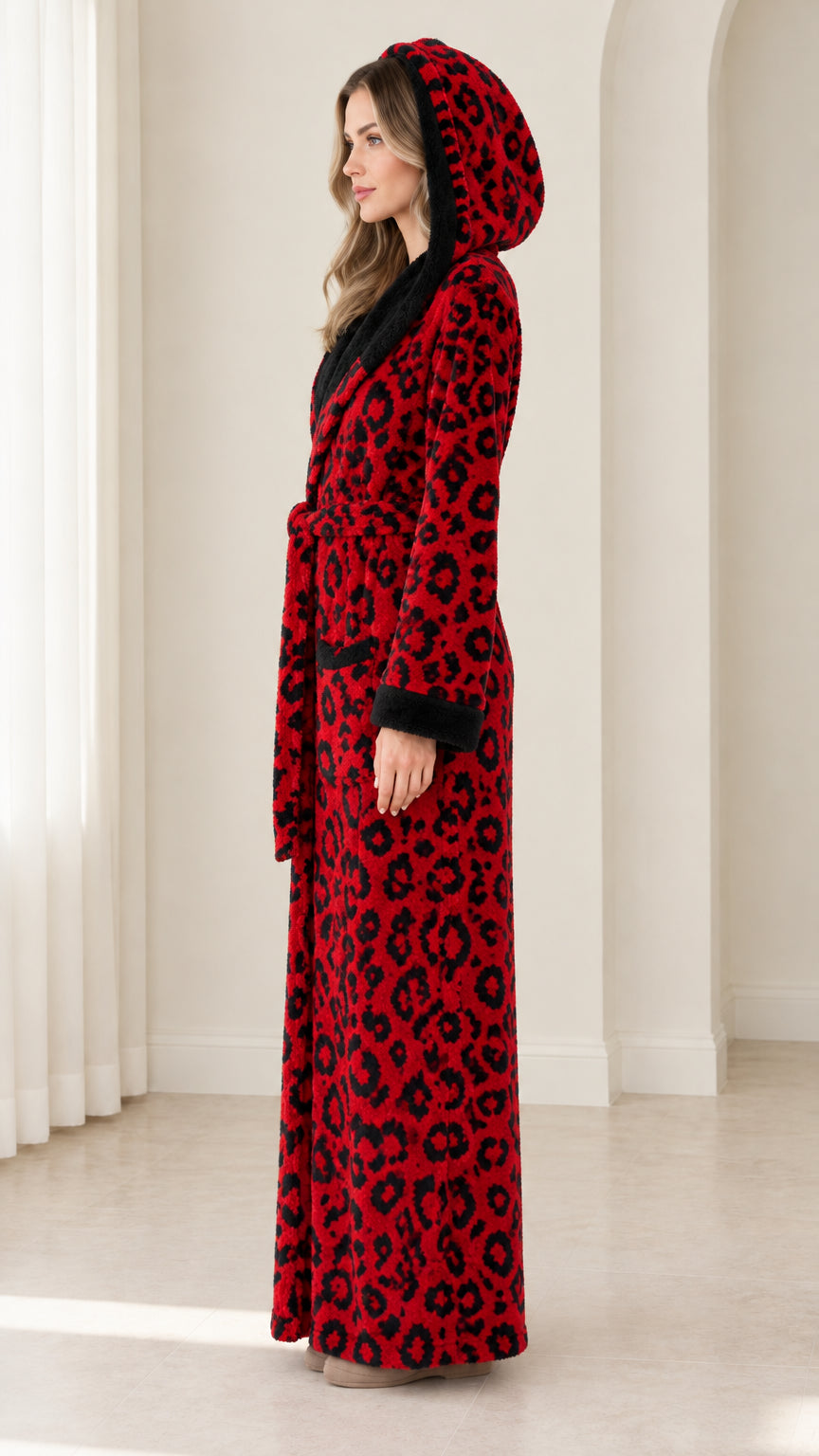 Side profile view of woman in red leopard print plush robe with hood up