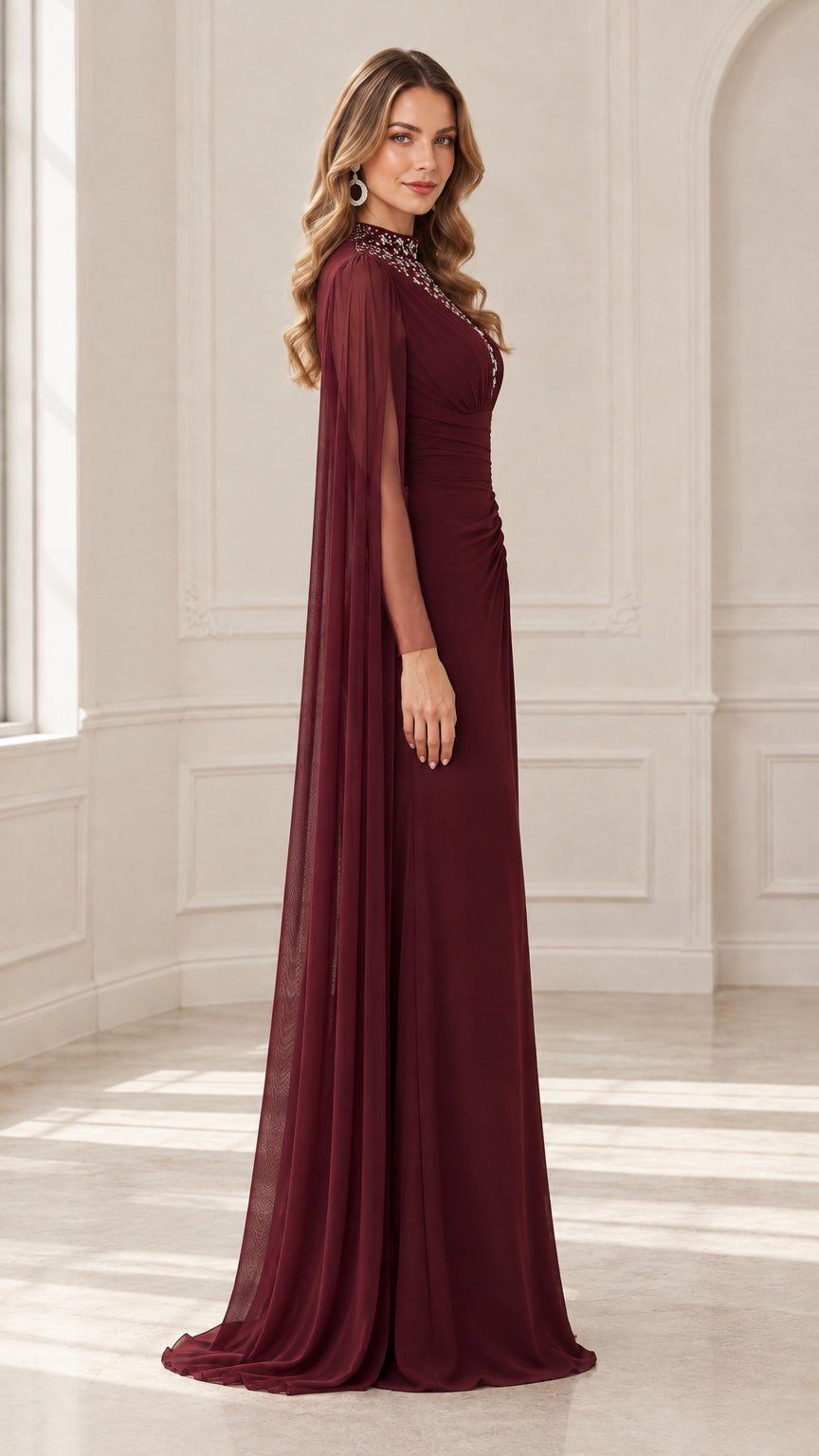 Side angle view of burgundy cape sleeve formal gown showing flowing silhouette