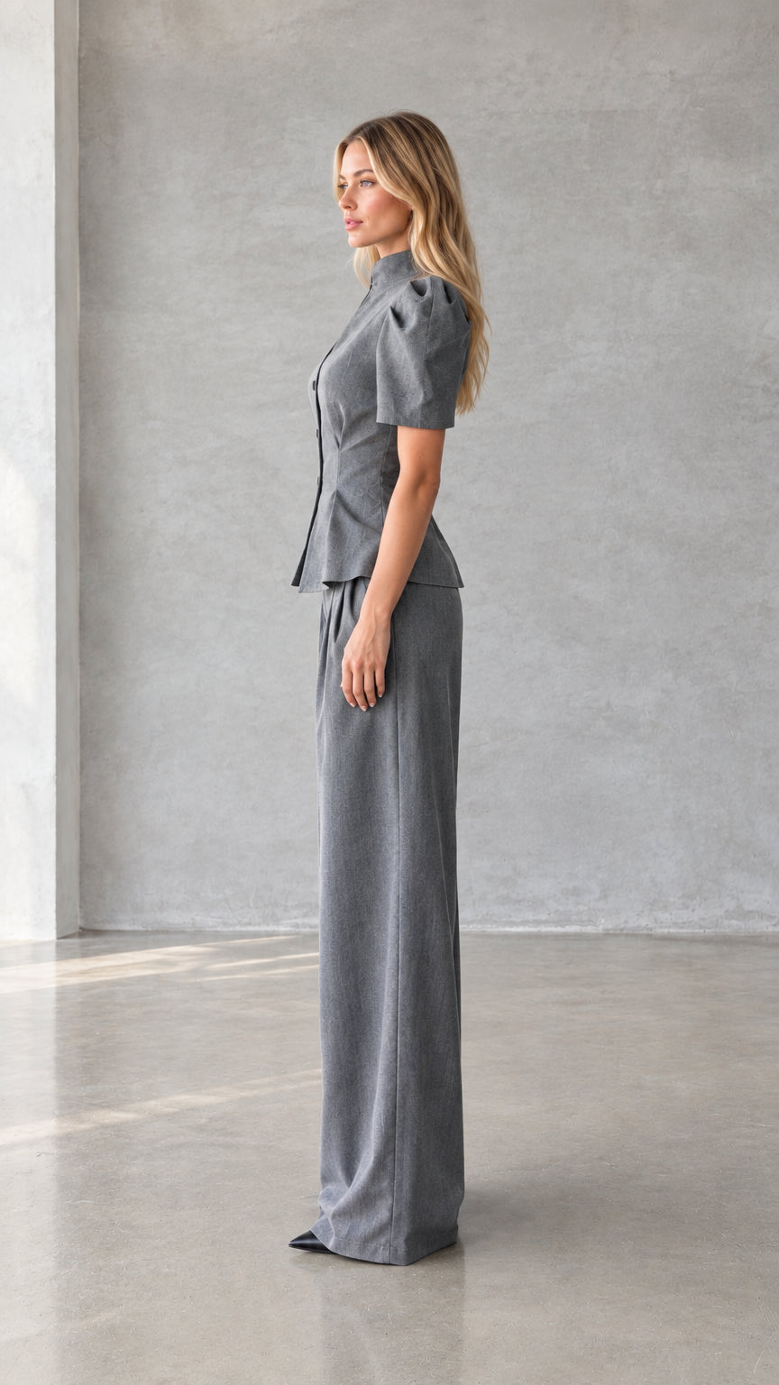 Side view of model wearing grey tailored short sleeve pant suit set