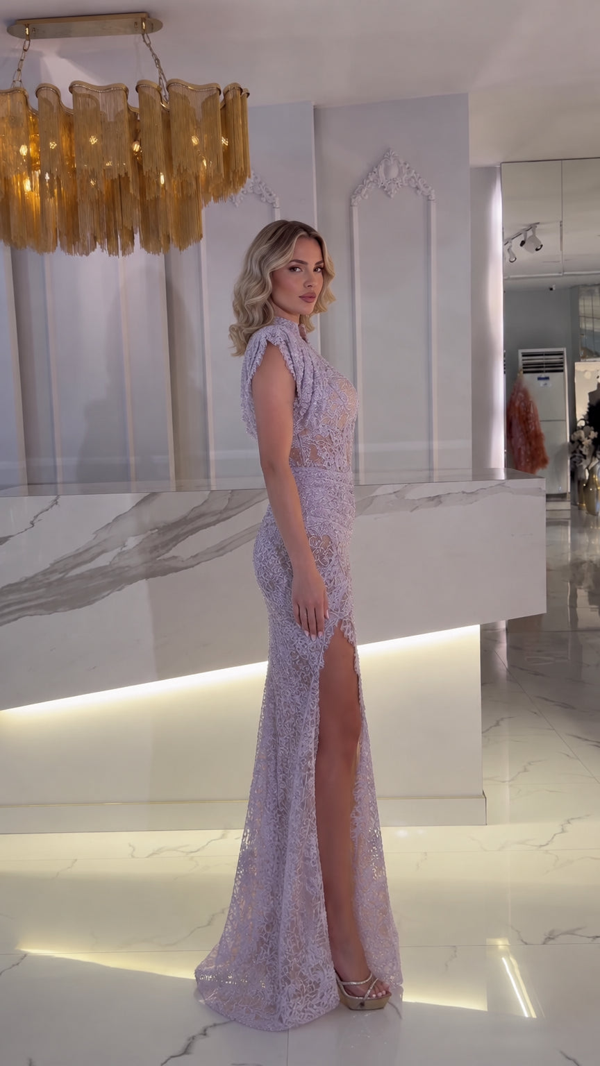 Side profile view of lavender high-neck lace maxi dress showing floor-length cut and slit