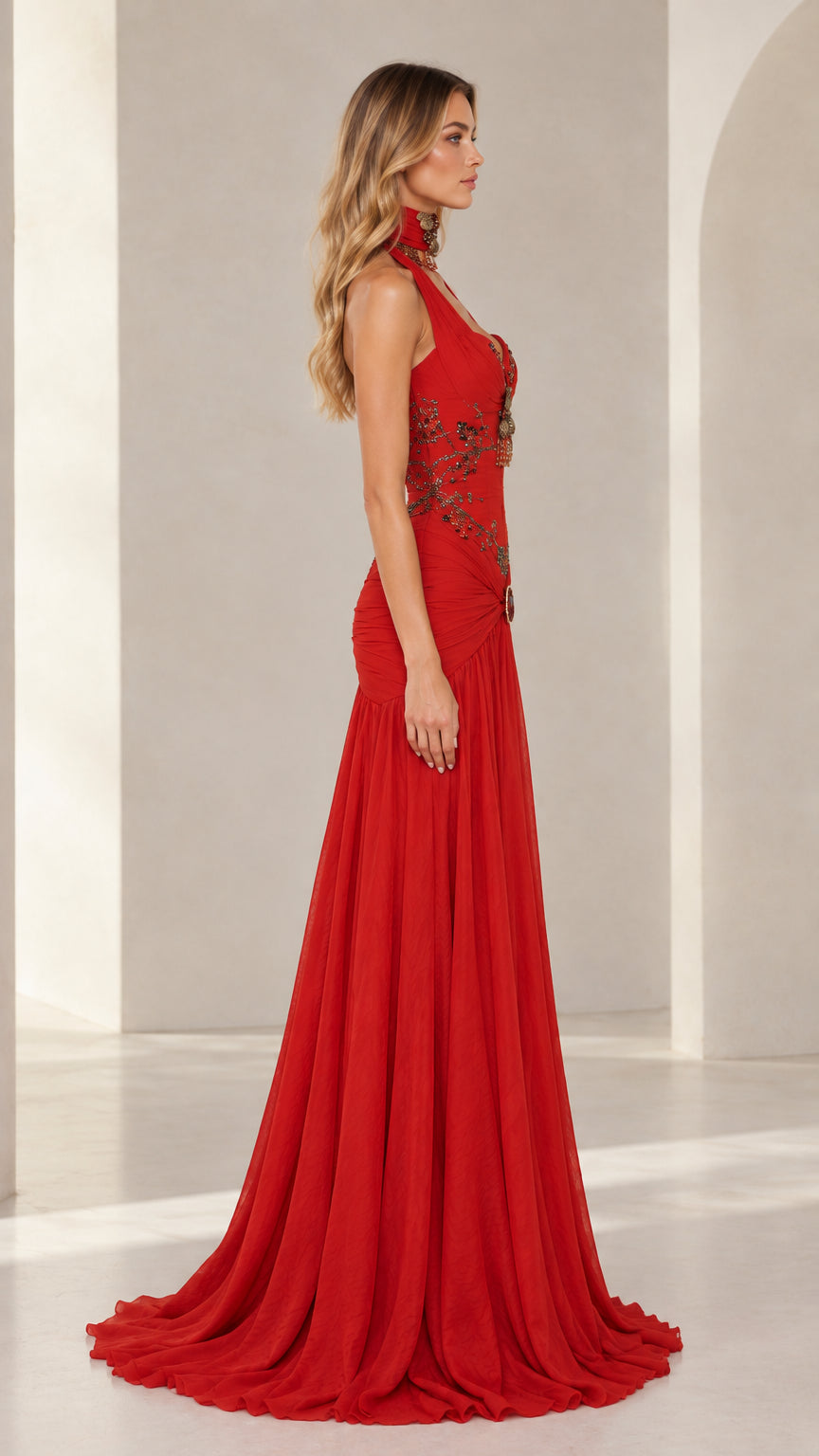 Side profile view of red formal halter gown with sweeping chiffon train
