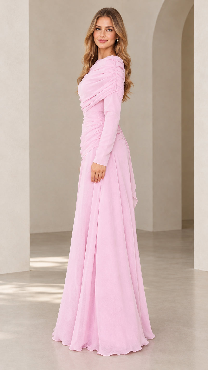 Side angle view of model wearing light pink ruched maxi formal dress