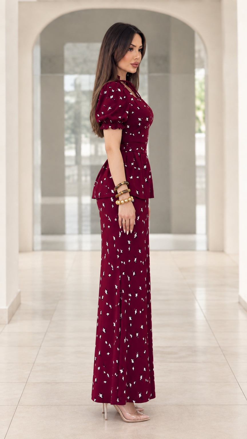 Side profile view of burgundy floral print peplum column maxi dress