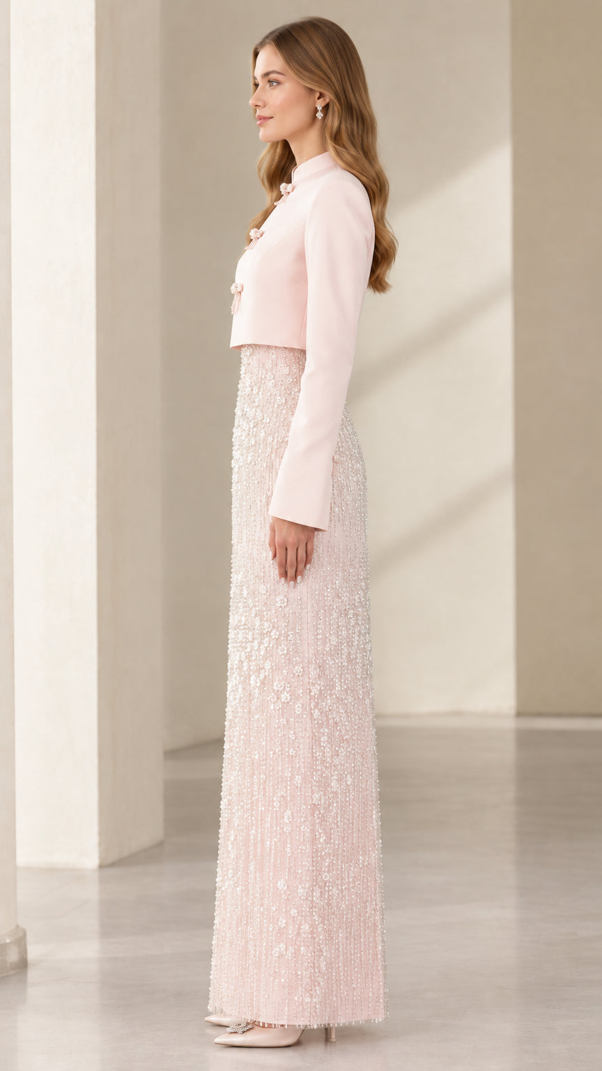 Model showcasing side profile of the Blush Pink beaded evening jacket dress set